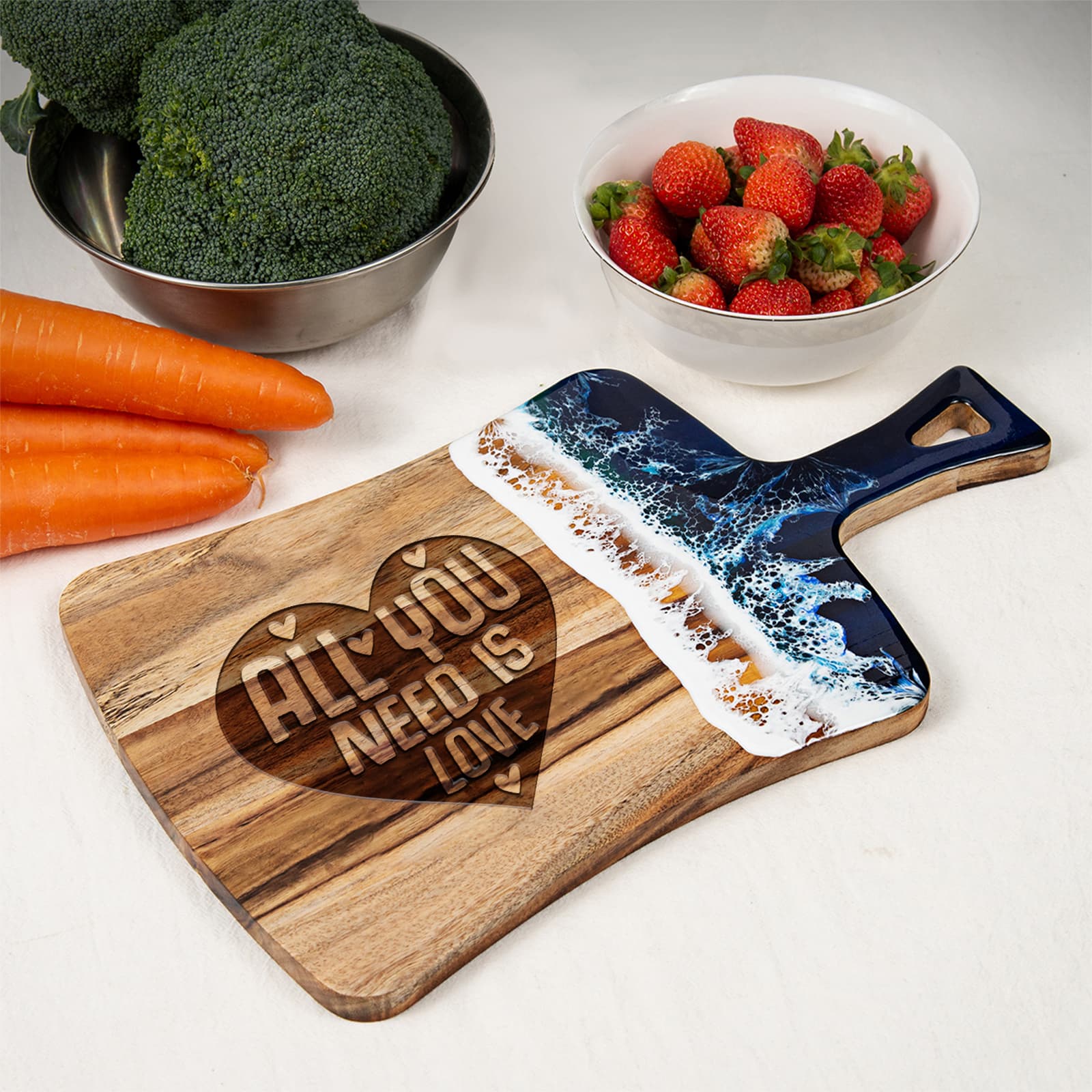 All You Need is Love fan-shaped ocean resin cutting board shown for light prep and serving with fruit and vegetables nearby